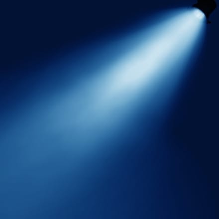 A spotlight shining in the darkness.
