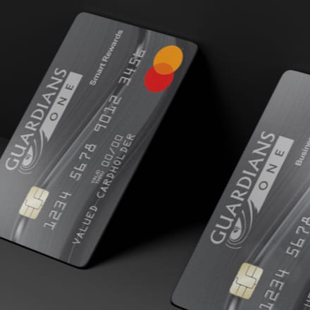 Two SFFCU, A Division of Guardians Credit Union credit cards standing at an angle.