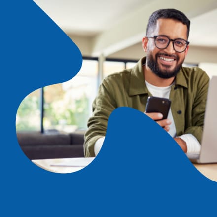 The face of a similing man in a clip mask of a puzzle piece.