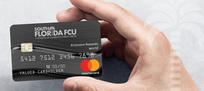 A hand holding the South Florida FCU, A Division of Guardians Credit Union Mastercard.