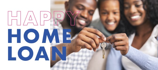 A young family sitting together while holding keys to a new home.