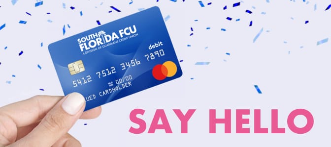 A hand holding the new Mastercard debit card surrounded by confetti.