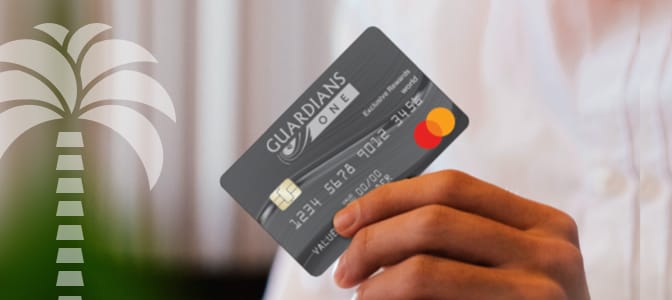 A hand holding the South Florida FCU, A Division of Guardians Credit Union Mastercard