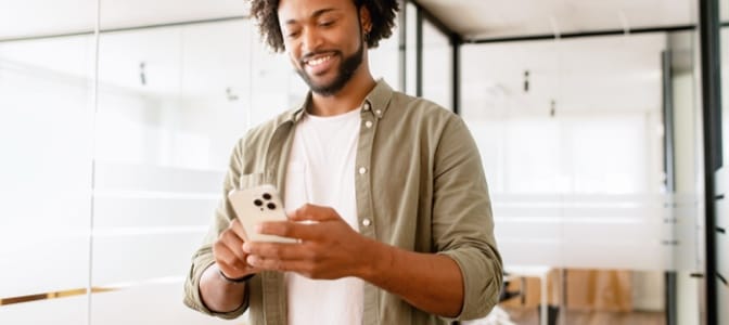 A person using a smart phone.