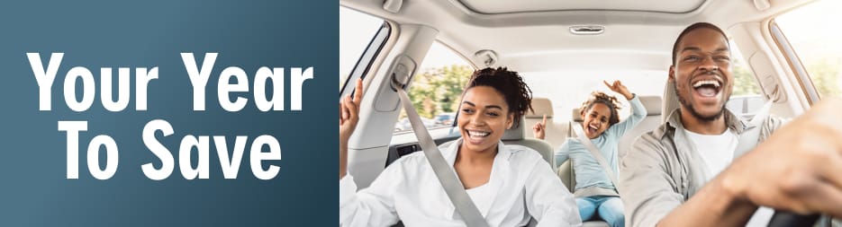 A happy family inside a car. To the left, the words: your year to save.