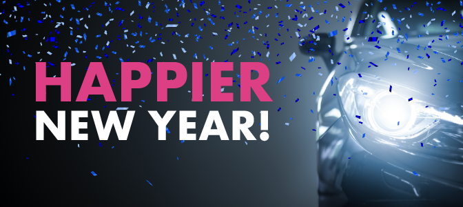 A closeup of a car headlight whose bright light reveals falling confetti. To the left, the words: Happier New Year!